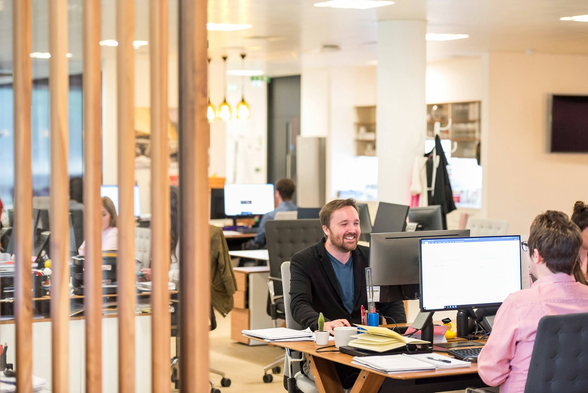 A small team at their desks in an office